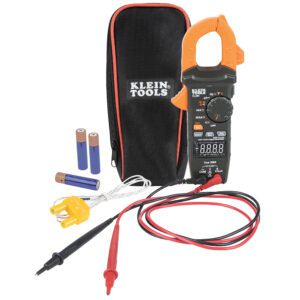 Digital clamp meter with accessories and case.