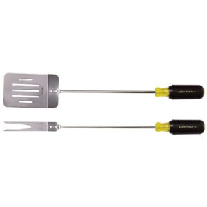 Barbecue spatula and fork with black handles.